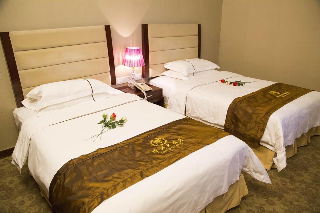 Long Zhou Grand Hotel Canton Chambre photo